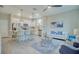 Open-concept kitchen and living area with modern appliances and furniture at 2112 Broome St, Kissimmee, FL 34743