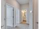 Hallway with carpet and access to bedrooms and bathroom at 2112 Broome St, Kissimmee, FL 34743
