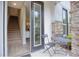 Townhouse entry with small patio, stairs, and view into the home at 2112 Broome St, Kissimmee, FL 34743