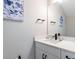 Modern bathroom with white vanity, quartz countertop, and black fixtures at 2112 Broome St, Kissimmee, FL 34743