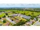 Aerial view of townhouses, pond, and surrounding area at 2112 Broome St, Kissimmee, FL 34743