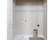 Laundry room with white shelving and tile flooring at 2112 Broome St, Kissimmee, FL 34743