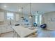 Open floor plan boasts modern kitchen with island and spacious living area at 2112 Broome St, Kissimmee, FL 34743