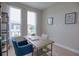 Bright home office features built-in shelving and a large desk at 2112 Broome St, Kissimmee, FL 34743