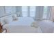 King-size bed in a well-lit Primary bedroom with balcony access at 2112 Broome St, Kissimmee, FL 34743
