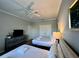 Spacious bedroom with two double beds and a dresser at 4814 Cayview Ave # 21013, Orlando, FL 32819