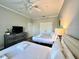 Spacious bedroom with two double beds and a dresser at 4814 Cayview Ave # 21013, Orlando, FL 32819