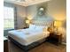King-size bed and stylish decor in a bright room at 4814 Cayview Ave # 21013, Orlando, FL 32819
