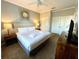Main bedroom with a king-size bed, nightstands, and a large mirror at 4814 Cayview Ave # 21013, Orlando, FL 32819
