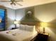 Spacious Primary bedroom with a king bed and lamps at 4814 Cayview Ave # 21013, Orlando, FL 32819