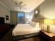 King-size bed, nightstands and large window at 4814 Cayview Ave # 21013, Orlando, FL 32819