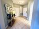 Bright entryway with tiled floor and decorative mirror at 4814 Cayview Ave # 21013, Orlando, FL 32819