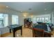 Game room features foosball, arcade game, pool table, and seating at 1561 Corolla Ct, Reunion, FL 34747
