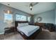 Spacious bedroom with large windows and a comfortable bed at 1561 Corolla Ct, Reunion, FL 34747