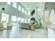 Bright and spacious living room with a double-height ceiling and views at 1561 Corolla Ct, Reunion, FL 34747