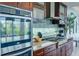 Modern kitchen with stainless steel appliances and granite countertops at 1561 Corolla Ct, Reunion, FL 34747