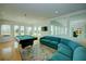 Relaxing game room with pool table and sectional sofa at 1561 Corolla Ct, Reunion, FL 34747
