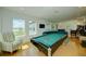 Pool table is the centerpiece of this game room at 1561 Corolla Ct, Reunion, FL 34747
