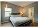 Comfortable bedroom with a queen-size bed and en-suite bathroom access at 1561 Corolla Ct, Reunion, FL 34747