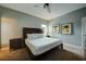 Bright bedroom featuring a king-size bed, wooden headboard, and neutral color palette at 1561 Corolla Ct, Reunion, FL 34747