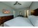 King-size bed, large dresser, and en-suite bathroom access at 1561 Corolla Ct, Reunion, FL 34747