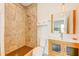 Clean bathroom with shower, toilet and modern vanity at 1561 Corolla Ct, Reunion, FL 34747
