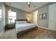 Bright bedroom with a king-size bed and en-suite bathroom at 1561 Corolla Ct, Reunion, FL 34747