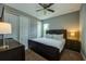 King-size bed and en-suite bathroom in this bedroom at 1561 Corolla Ct, Reunion, FL 34747