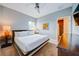 Spacious Primary bedroom with king-size bed and ensuite bathroom at 1561 Corolla Ct, Reunion, FL 34747