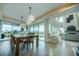 Bright dining room with large sliding doors leading to patio and pool at 1561 Corolla Ct, Reunion, FL 34747