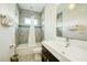 Clean bathroom with tub and modern vanity at 1561 Corolla Ct, Reunion, FL 34747