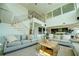 Open concept living area with modern staircase and kitchen views at 1561 Corolla Ct, Reunion, FL 34747