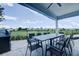 Outdoor patio with seating area and grill at 1561 Corolla Ct, Reunion, FL 34747