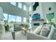 Spacious living room with high ceilings, fireplace, and large windows at 1561 Corolla Ct, Reunion, FL 34747