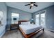 Bedroom with a queen-size bed and private balcony access at 1561 Corolla Ct, Reunion, FL 34747