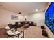 Elegant home theater with large screen and comfortable seating at 1561 Corolla Ct, Reunion, FL 34747