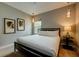 Bedroom with a queen-size bed, calming decor, and access to a private balcony at 1561 Corolla Ct, Reunion, FL 34747