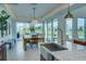 Spacious dining area with large sliding glass doors opening to a patio and backyard at 1561 Corolla Ct, Reunion, FL 34747
