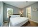 Bright bedroom with a king-size bed and en-suite bathroom at 1561 Corolla Ct, Reunion, FL 34747