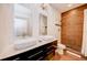 Bathroom with double sinks and a large walk in shower at 1561 Corolla Ct, Reunion, FL 34747