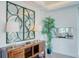 Bright entryway with decorative mirror and console table at 1561 Corolla Ct, Reunion, FL 34747