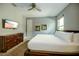 Spacious bedroom with large bed, dresser, and TV at 1561 Corolla Ct, Reunion, FL 34747
