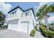 Modern two-story home with two-car garage and balcony at 1561 Corolla Ct, Reunion, FL 34747