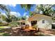 Relaxing backyard deck with seating area and beautiful landscaping at 425 Whispering Oak Ln, Apopka, FL 32712