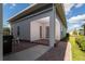 Rear exterior view showing patio and landscaping at 14663 Englert Aly, Orlando, FL 32827