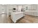 Modern kitchen with light gray cabinets and island at 14663 Englert Aly, Orlando, FL 32827