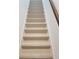 Modern staircase with light wood-look risers and gray treads at 14663 Englert Aly, Orlando, FL 32827