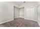 Spacious bedroom with double doors leading to a closet and carpeted floor at 14663 Englert Aly, Orlando, FL 32827