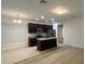 Modern kitchen with island, dark cabinets, granite counters, and stainless steel appliances at 14663 Englert Aly, Orlando, FL 32827
