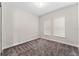Well-lit bedroom featuring neutral walls and plush carpeting at 14663 Englert Aly, Orlando, FL 32827
